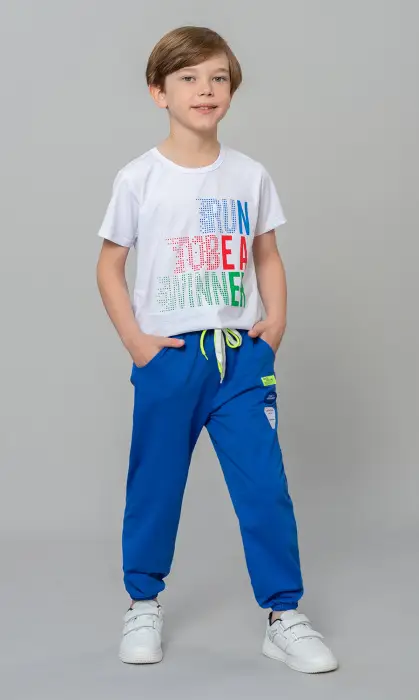 Брюки спортивные для мальчика, на манжете, с  завязками и принтом (4-8 лет)